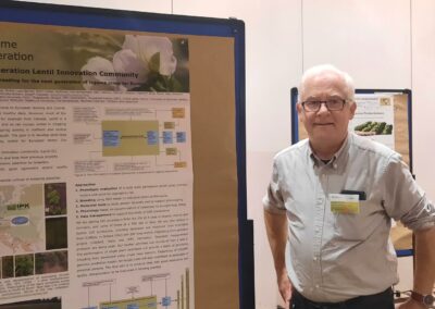 Donal Murphy-Bokern standing in front of the Legume Generation poster at the second national Legumes Congress 2024