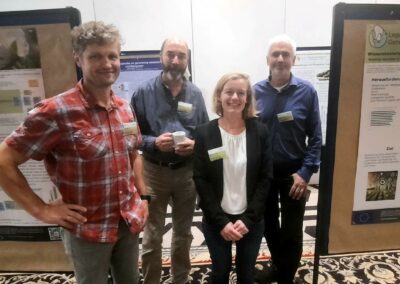 Four researchers from the Legume Generation project standing in front of research posters at the 2024 National Legume Congress in Leipzig, Germany.